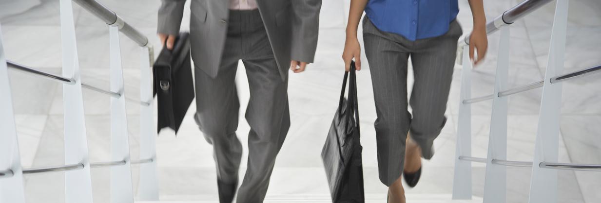 Two healthcare professionals holding briefcases